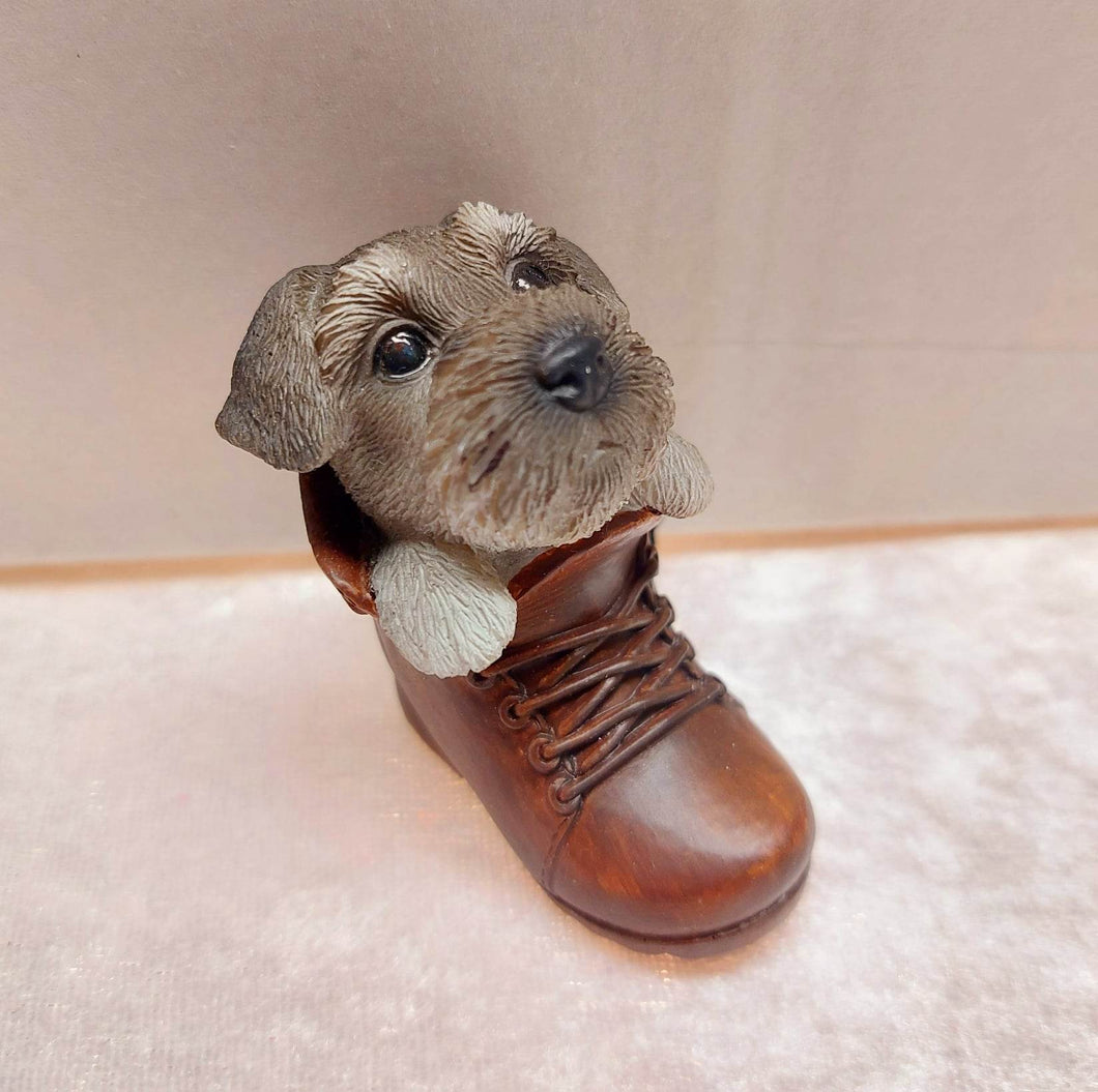 Vivid arts puppy in boot - Schnauzer